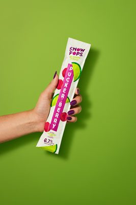 Image of SnowPops Puckerberry Popsicle in-hand.